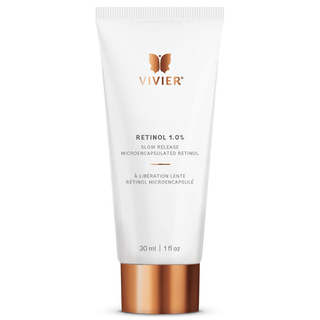 A white tube labeled "VIVIER, Retinol 1.0%,” with a rose gold cap, containing 30 ml or 1 fl. oz. of product