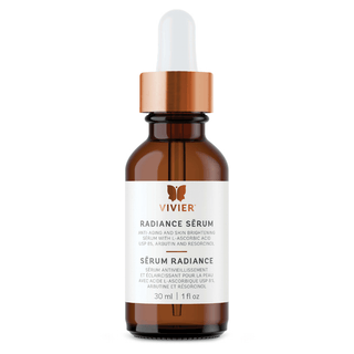 A brown glass bottle labeled "VIVIER, Radiance Serum; Anti-Aging and Skin Brightening Serum with L-Ascorbic Acid USP 8%, Arbutin and Resorcinol,” with a rose gold and white dropper cap, containing 30 ml or 1 fl. oz. of product