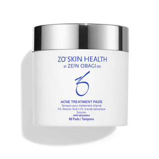 A white container labeled "ZO Skin Health by Zein Obagi MD, Acne Treatment Pads (2% Salicylic Acid)," with a silver lid, containing 60 textured pads